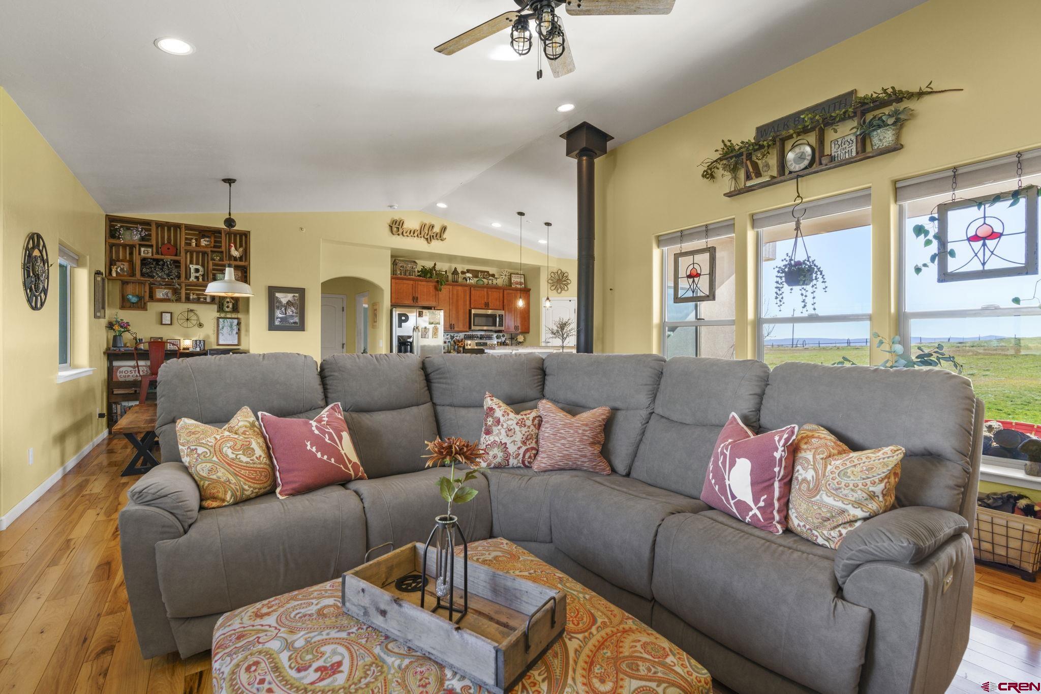 172 Encantado Lane Durango, CO 81303 - Photo 5 of 38 a living room with furniture and a chandelier