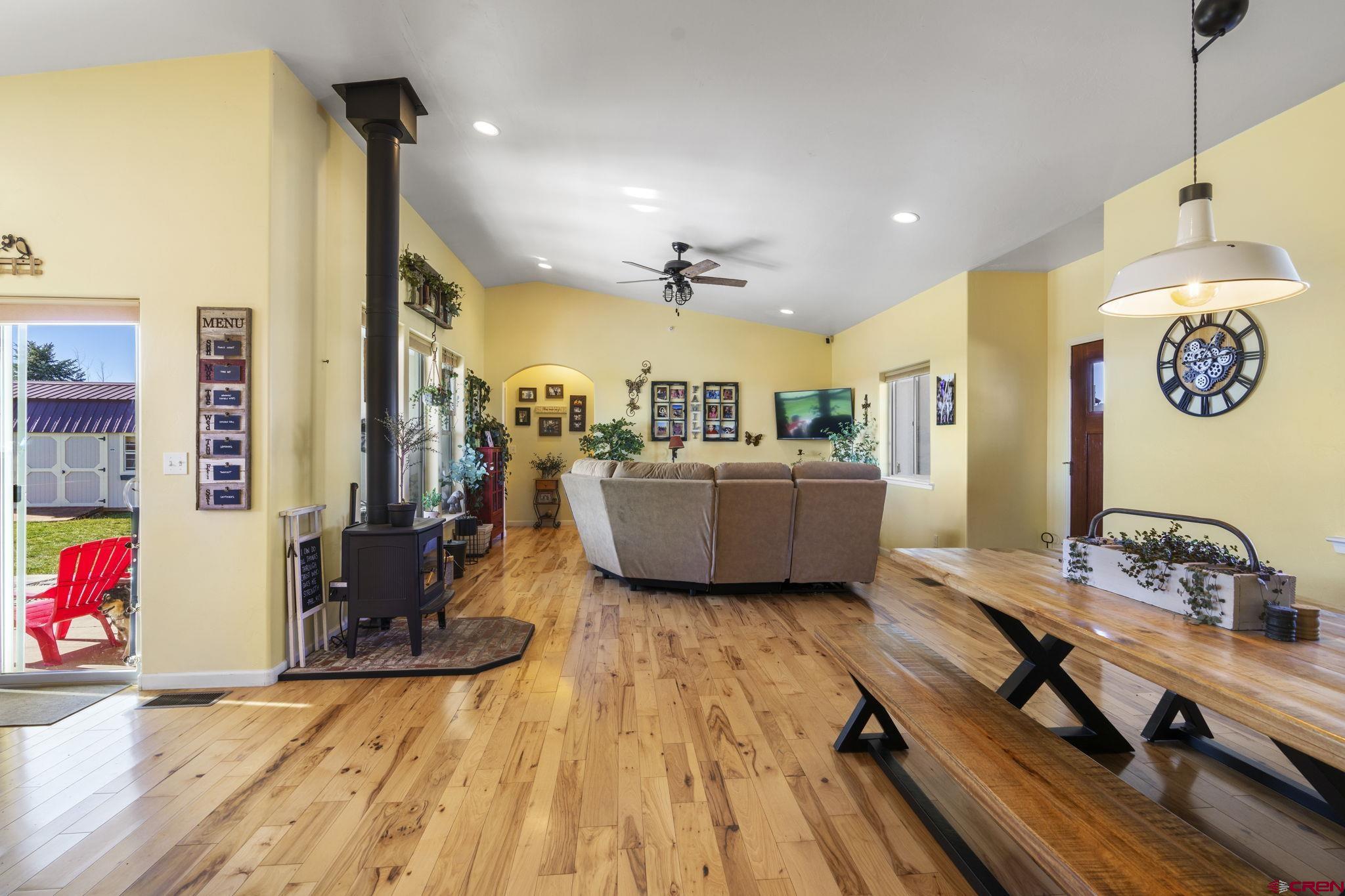 172 Encantado Lane Durango, CO 81303 - Photo 7 of 38 a living room with furniture and a chandelier