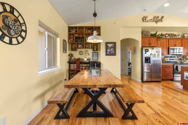 a dining room with furniture and window