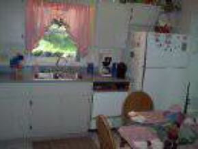 1205 Northwest Rugen Palm Bay, FL 32907 - Photo 3 of 5 a close view of chair and table in a room