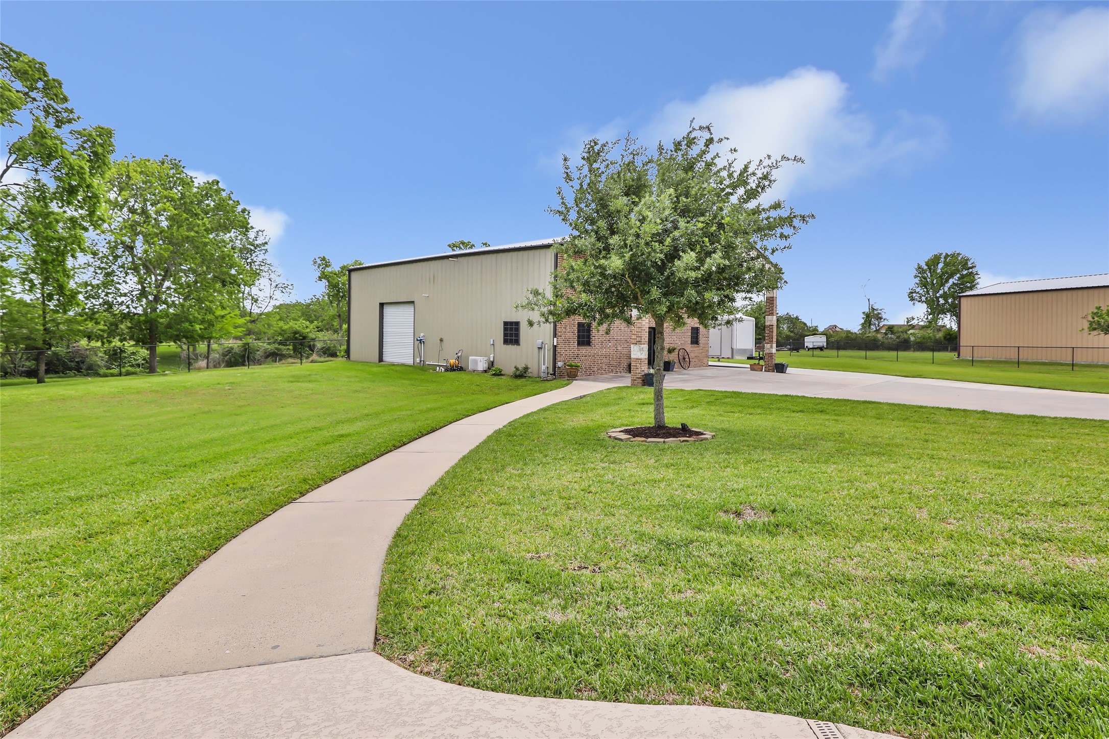 6202 Circle Back Road Baytown, TX 77523 - Photo 5 of 50 Sidewalk leading to shop/guest quarters from pool