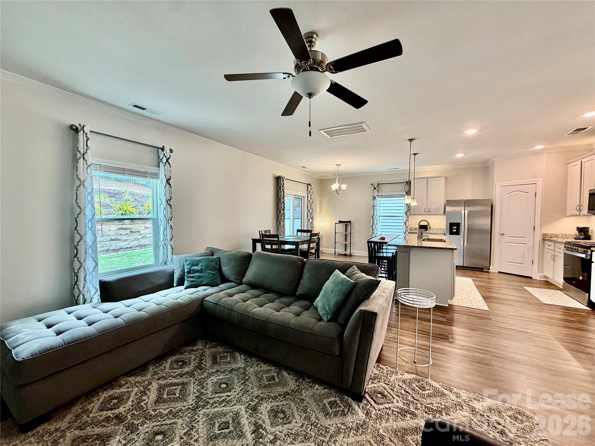 1220 Pecan Ridge Road Fort Mill, SC 29715 - Photo 6 of 25 a living room with furniture and kitchen view