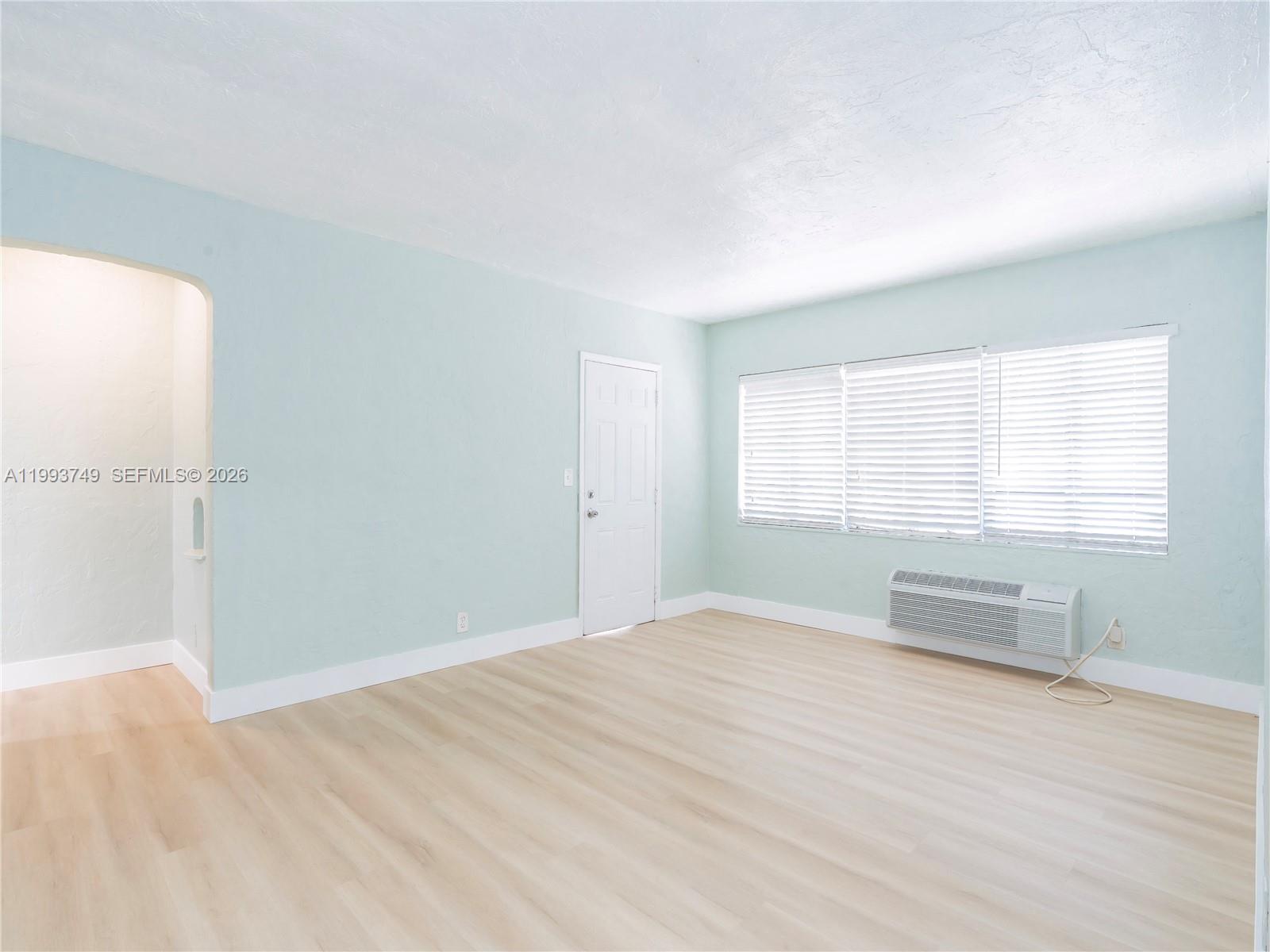 7635 Dickens Avenue, Unit 3 Miami Beach, FL 33141 - Photo 3 of 9 a view of an empty room with a window