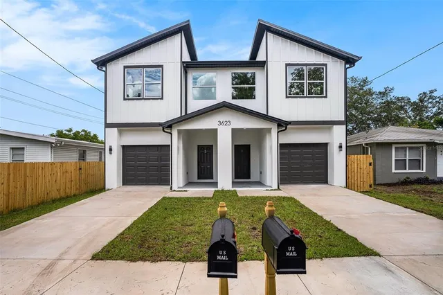 a front view of a house with yard