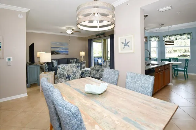 a large white kitchen with a large window