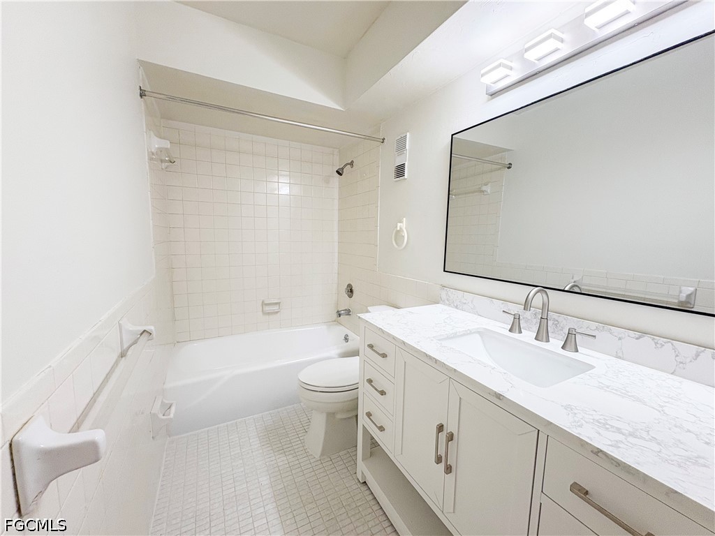 1830 Brantley Road, Unit I7 Fort Myers, FL 33907 - Photo 22 of 34 a bathroom with a granite countertop sink toilet and shower
