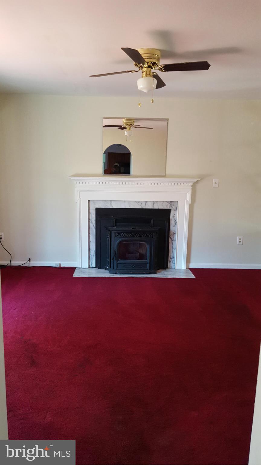 6701 Cherryfield Road Fort Washington, MD 20744 - Photo 8 of 28 Family Room With Pellet Stove