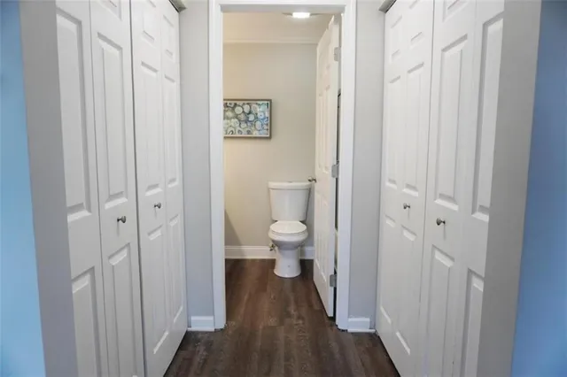 a view of a bathroom from a hallway