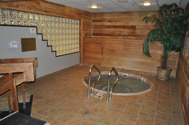 a living room with furniture fireplace and a flat screen tv