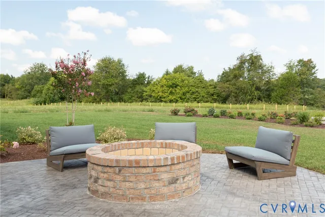 a view of a garden with furniture