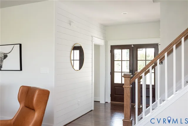 a front view of a house with wooden floor and windows