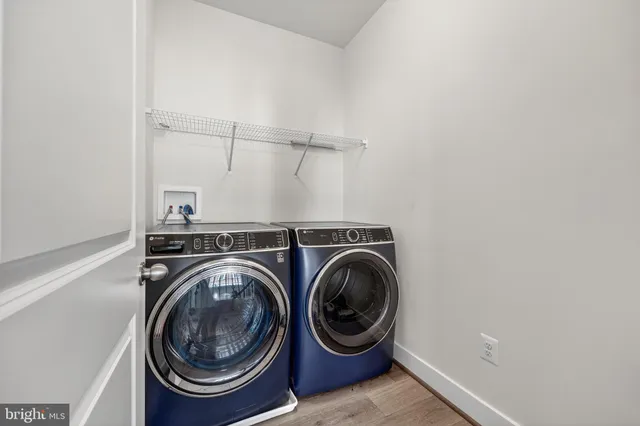 a view of storage and utility room with washer and dryer