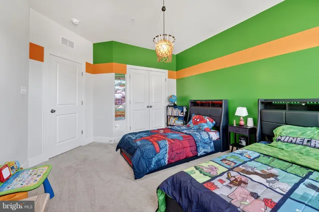 a bedroom with a bed and a dresser