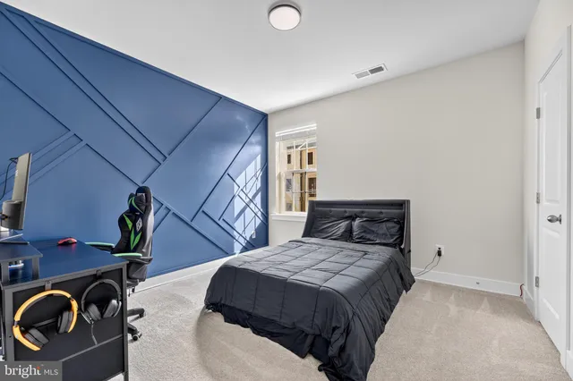 a bedroom with a bed and a television