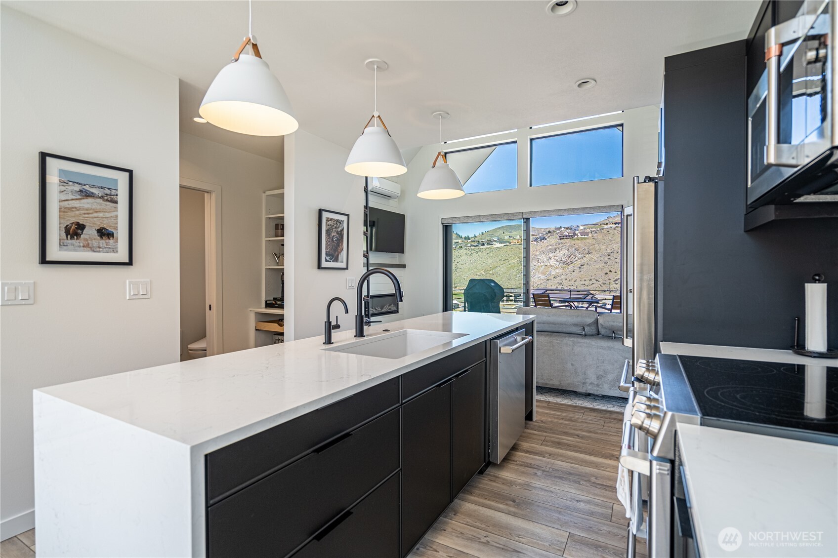 1418 Cottage Lane Chelan, WA 98816 - Photo 11 of 40 a kitchen with a sink a counter top space and stainless steel appliances