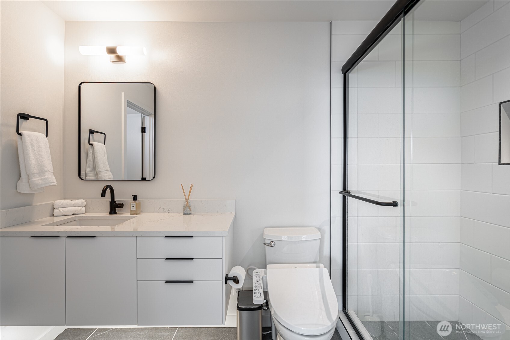1418 Cottage Lane Chelan, WA 98816 - Photo 19 of 40 a bathroom with a toilet sink and mirror