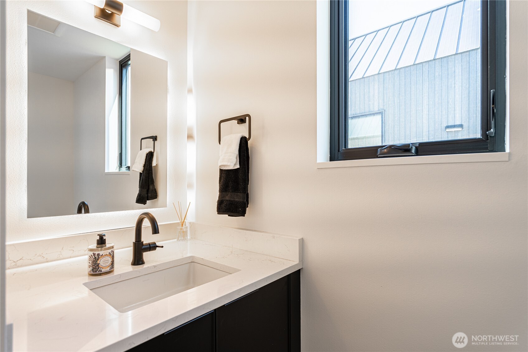 1418 Cottage Lane Chelan, WA 98816 - Photo 26 of 40 a bathroom with a sink and a mirror