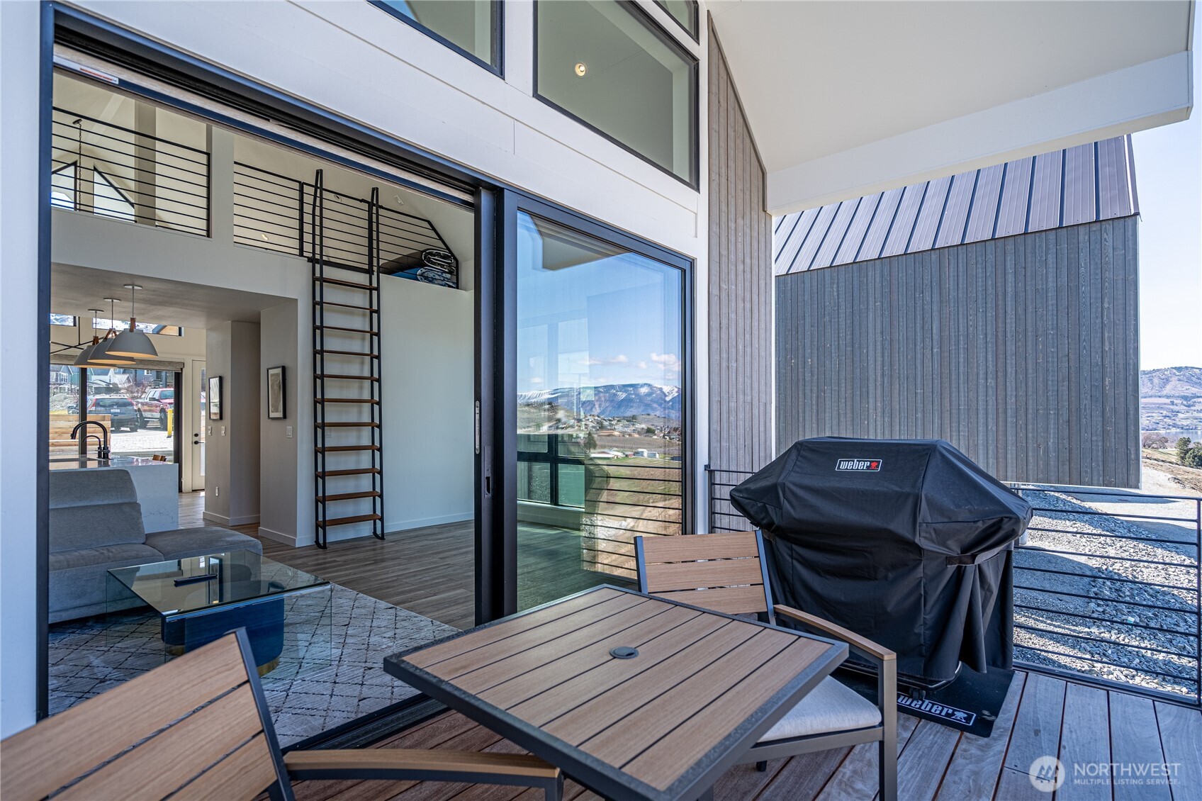 1418 Cottage Lane Chelan, WA 98816 - Photo 29 of 40 a view of a deck with wooden floor and outdoor seating