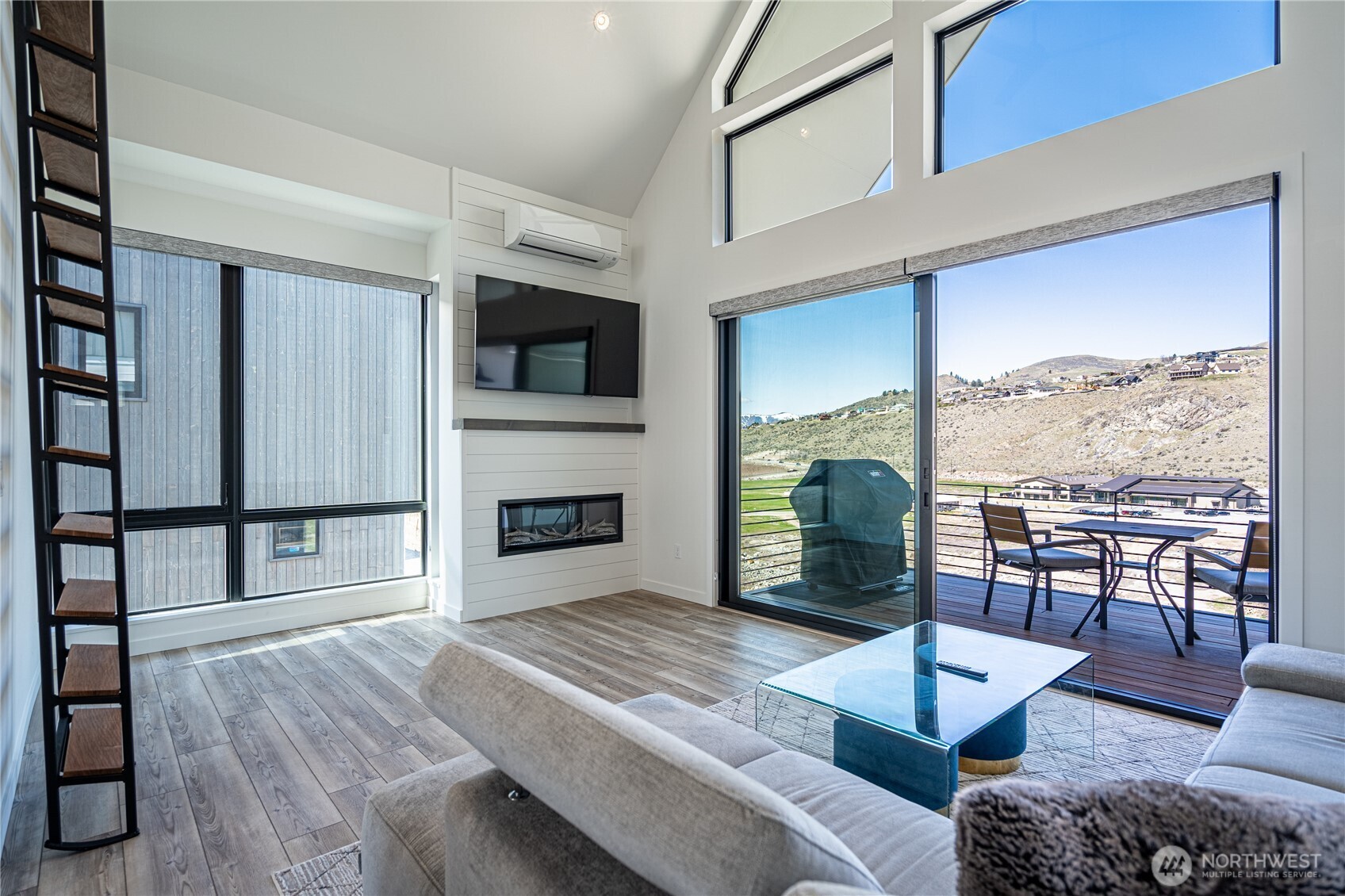 1418 Cottage Lane Chelan, WA 98816 - Photo 6 of 40 a living room with furniture fireplace and flat screen tv