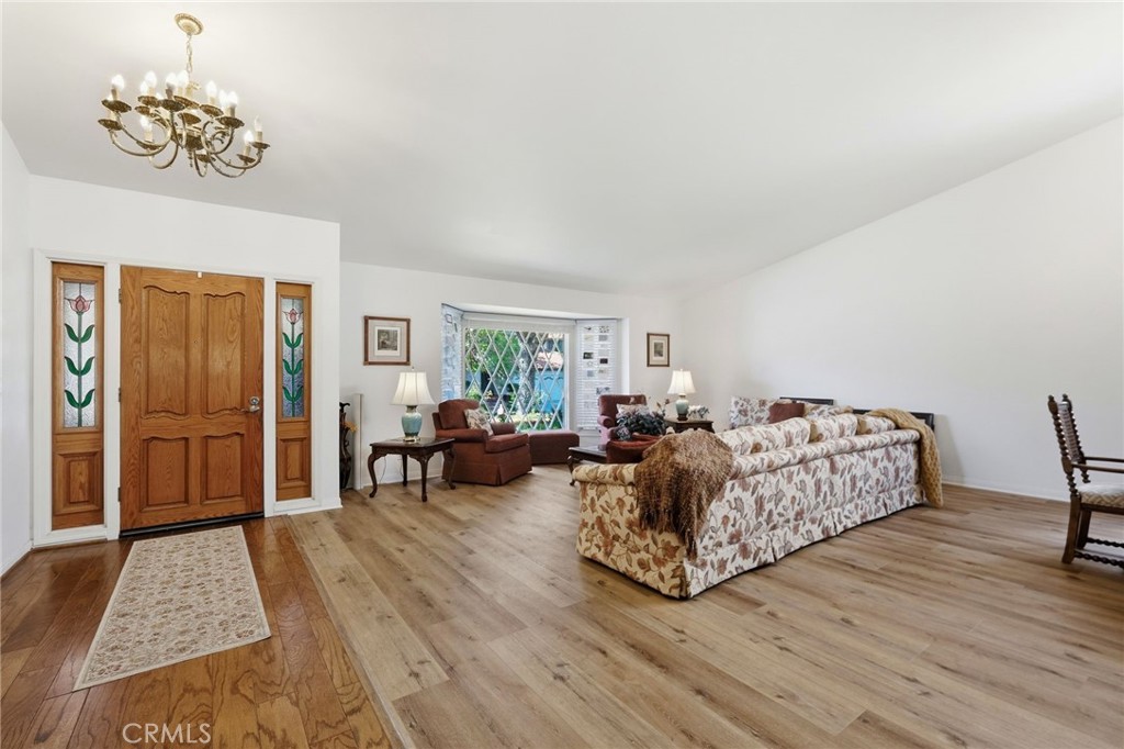 18233 Charlton Lane Porter Ranch, CA 91326 - Photo 6 of 40 a living room with furniture and a table