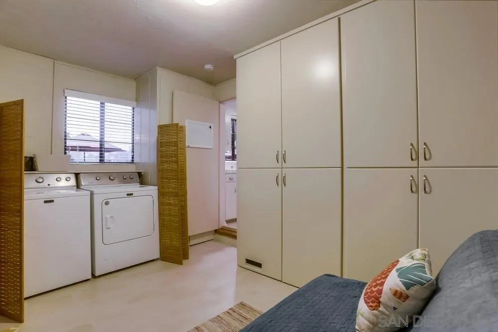506 Pacific Avenue Solana Beach, CA 92075 - Photo 11 of 13 a view of kitchen with refrigerator and white cabinets