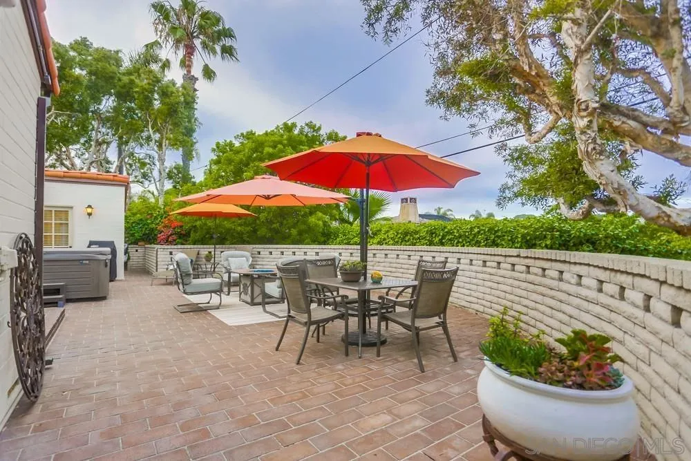 506 Pacific Avenue Solana Beach, CA 92075 - Photo 12 of 13 a patio with a patio table and chairs