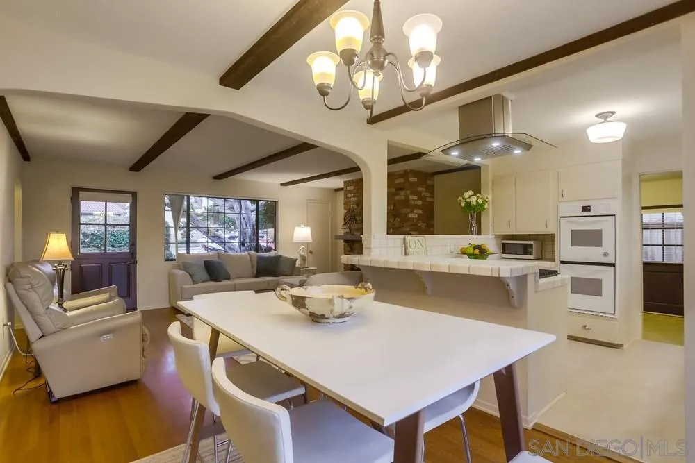 506 Pacific Avenue Solana Beach, CA 92075 - Photo 4 of 13 a view of a dining room with furniture and wooden floor