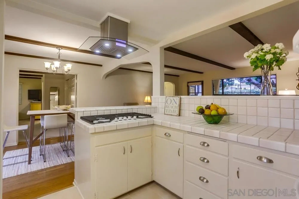 506 Pacific Avenue Solana Beach, CA 92075 - Photo 6 of 13 a kitchen with cabinets and window