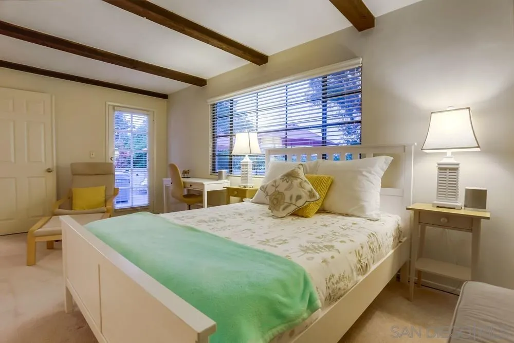 506 Pacific Avenue Solana Beach, CA 92075 - Photo 7 of 13 a bedroom with a bed and window