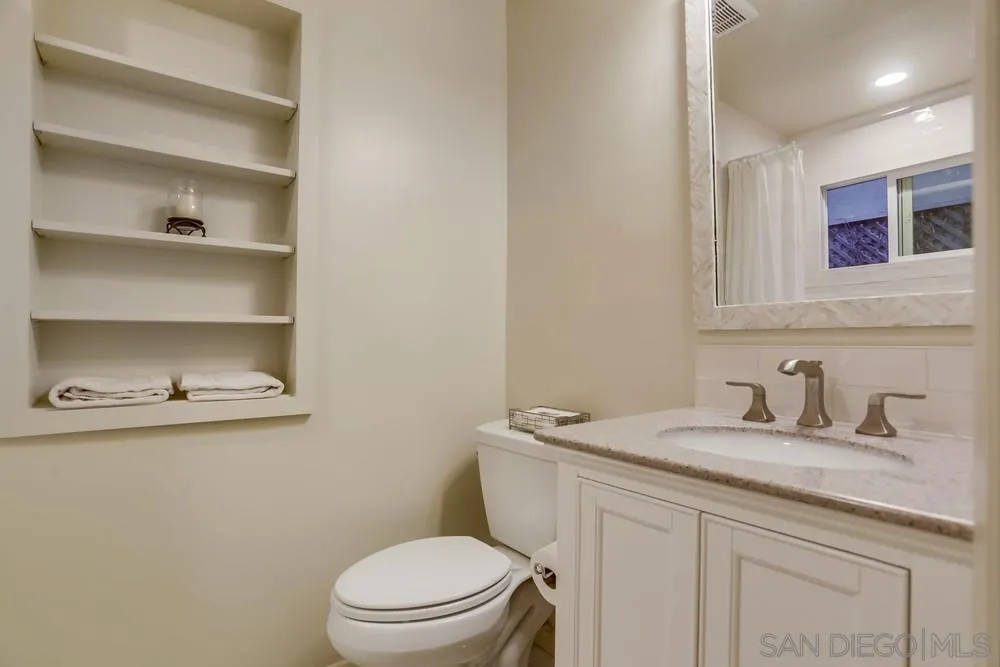 506 Pacific Avenue Solana Beach, CA 92075 - Photo 8 of 13 a bathroom with a sink a toilet and vanity