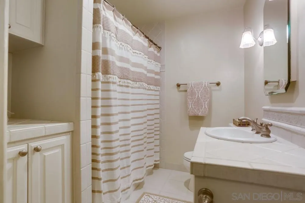 506 Pacific Avenue Solana Beach, CA 92075 - Photo 10 of 13 a bathroom with a sink toilet and shower