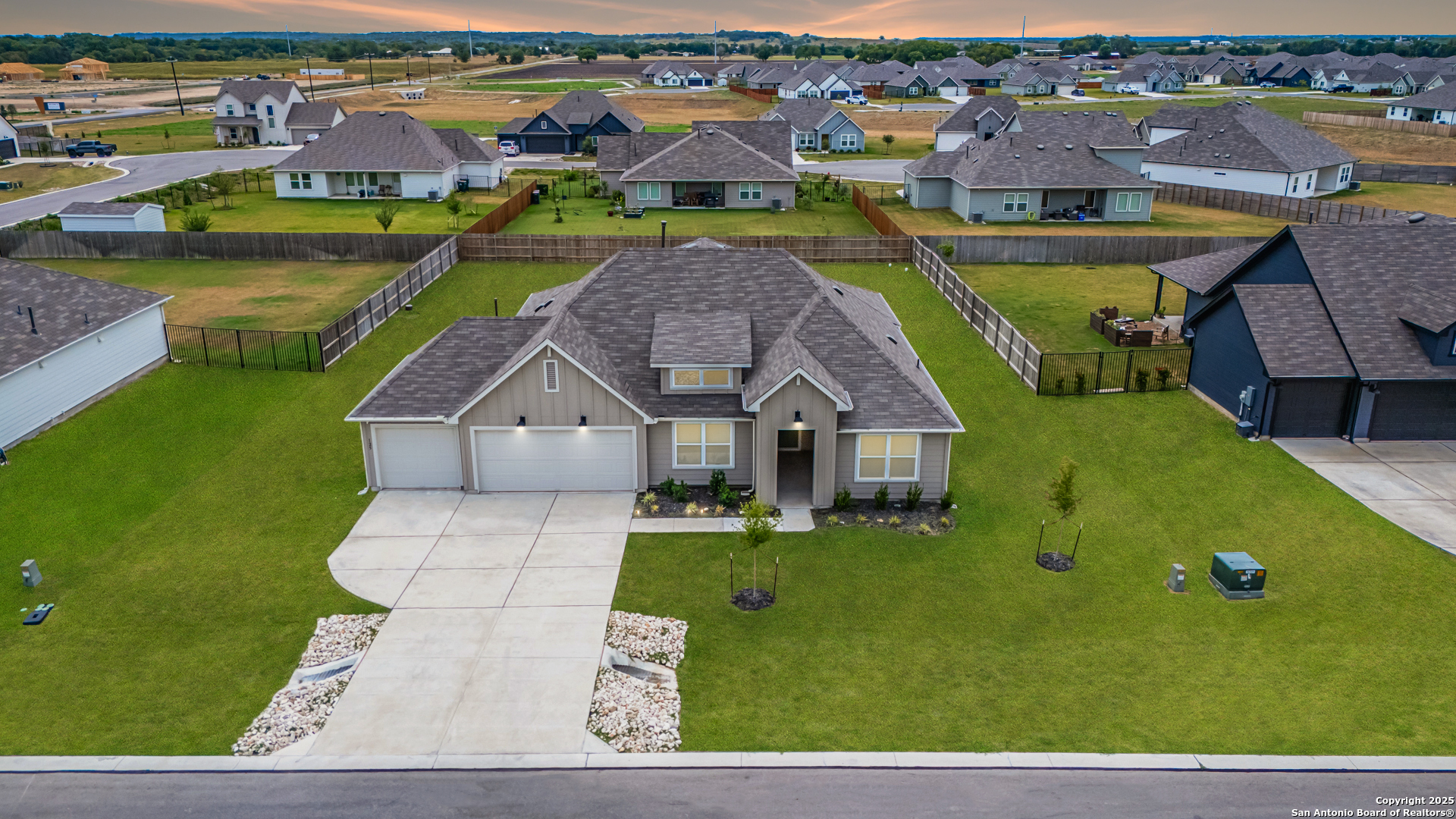 an aerial view of a house with a garden