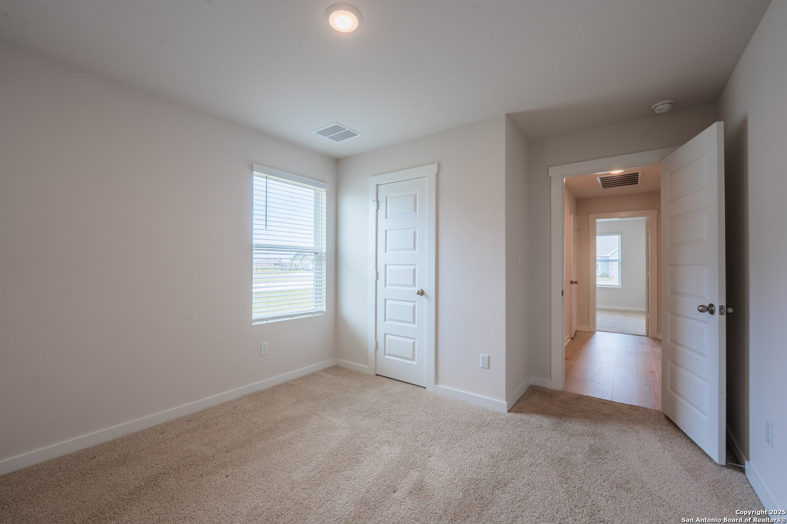 125 Nicks Cove Lockhart, TX 78644 - Photo 25 of 40 an empty room with windows and closet