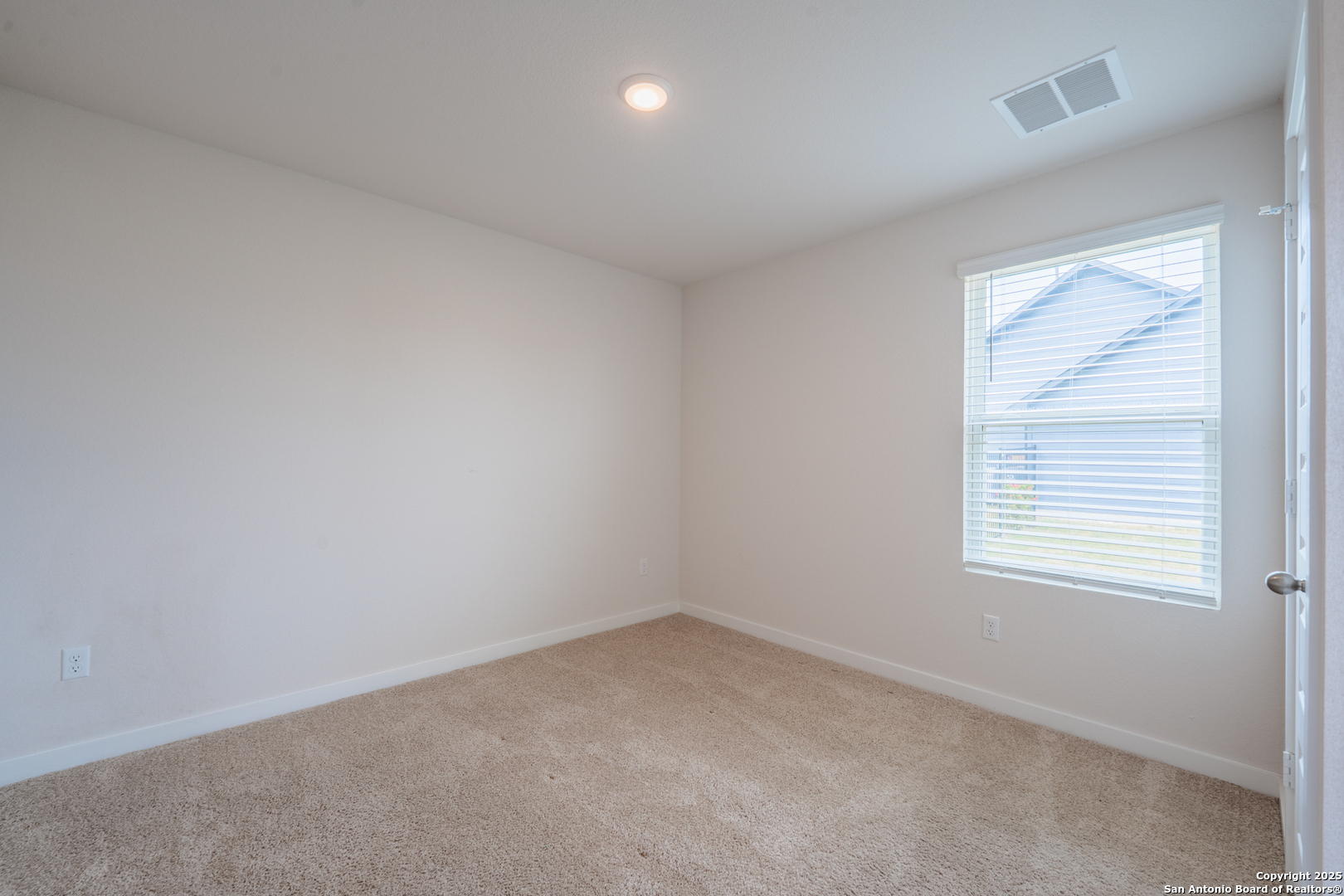 125 Nicks Cove Lockhart, TX 78644 - Photo 26 of 40 an empty room with a window