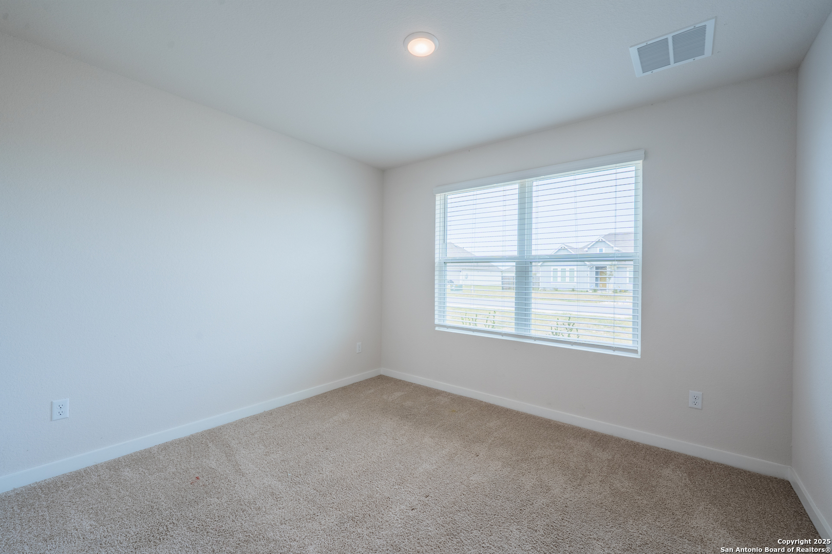 125 Nicks Cove Lockhart, TX 78644 - Photo 30 of 40 an empty room with a window