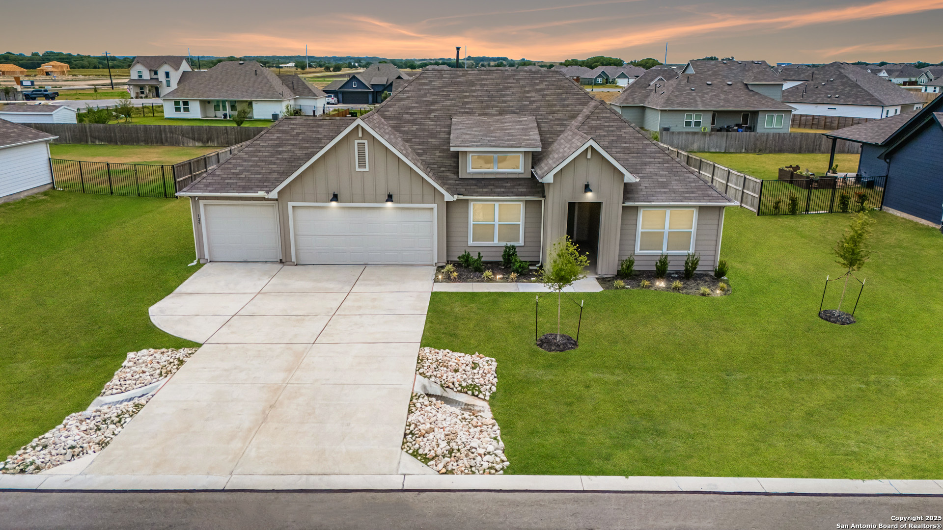 125 Nicks Cove Lockhart, TX 78644 - Photo 3 of 40 a view of house with garden