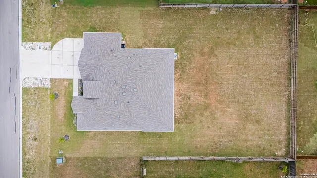 a view of a swimming pool and a yard