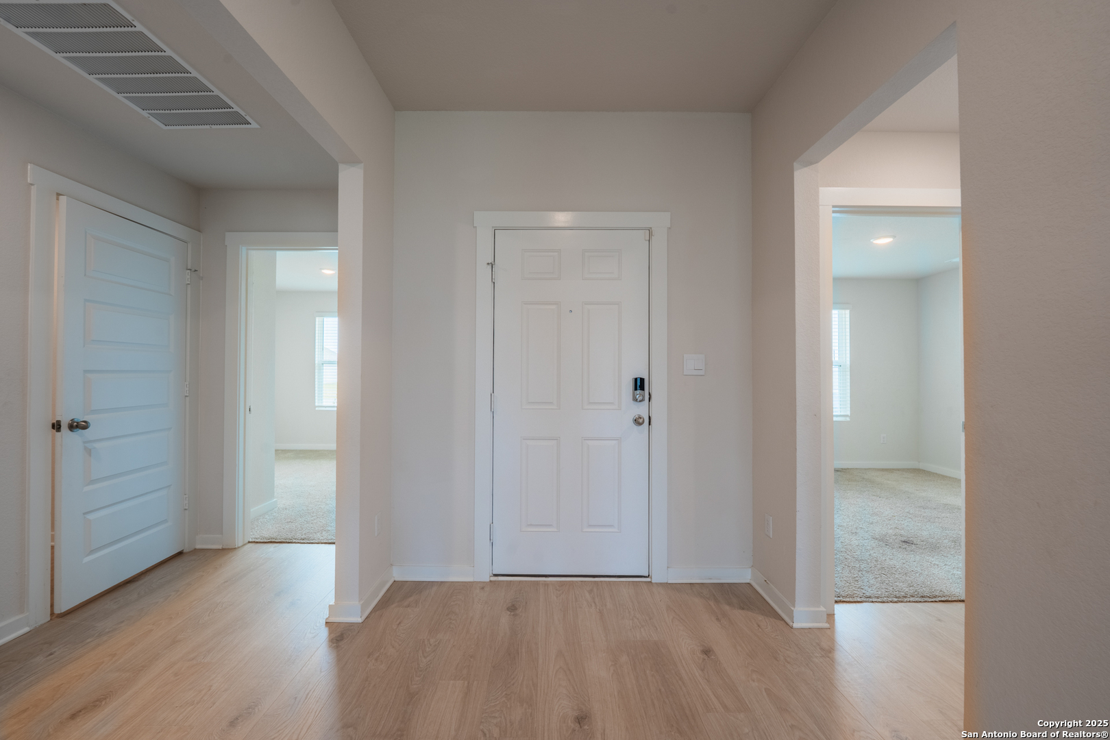 125 Nicks Cove Lockhart, TX 78644 - Photo 4 of 40 a view of a room with wooden floor