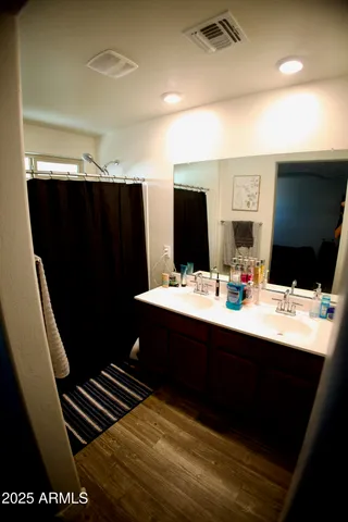 a bathroom with a sink and a mirror