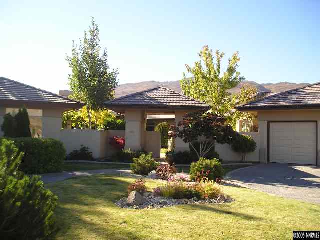 621 Meadowgate Court Reno, NV 89519 - Photo 1 of 9 a front view of a house with a yard and a garden