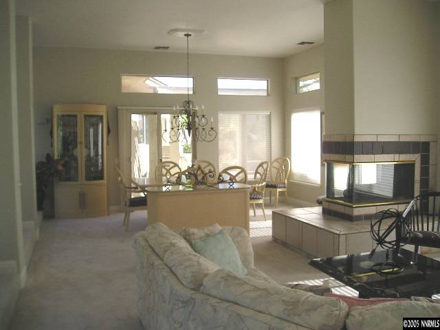 621 Meadowgate Court Reno, NV 89519 - Photo 2 of 9 a living room with couches and chandelier