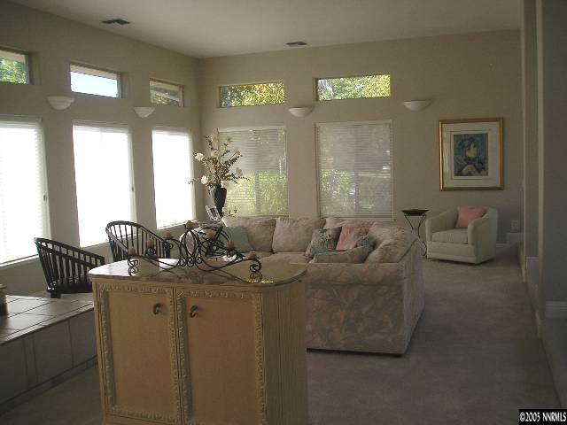 621 Meadowgate Court Reno, NV 89519 - Photo 3 of 9 a living room with furniture and a large mirror