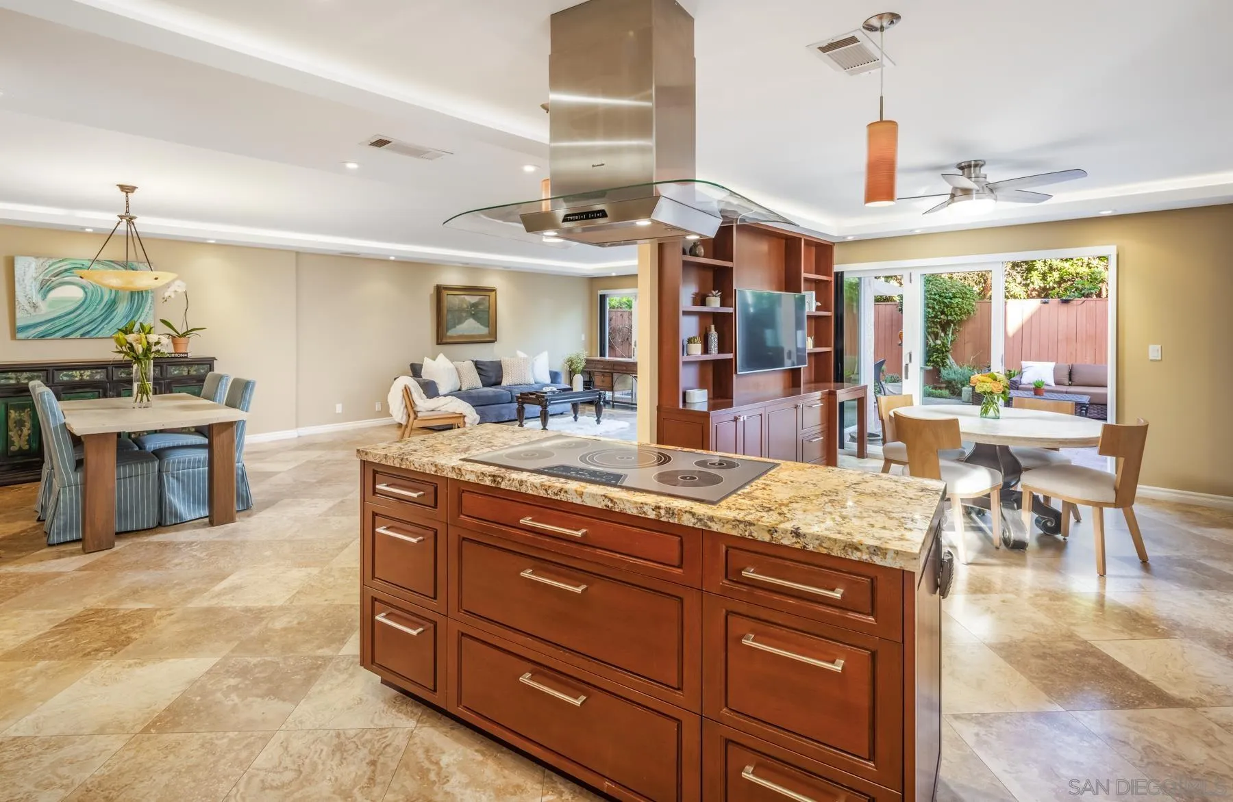 89 Trinidad Bend Coronado, CA 92118 - Photo 13 of 40 a kitchen with stainless steel appliances kitchen island granite countertop a table and chairs in it