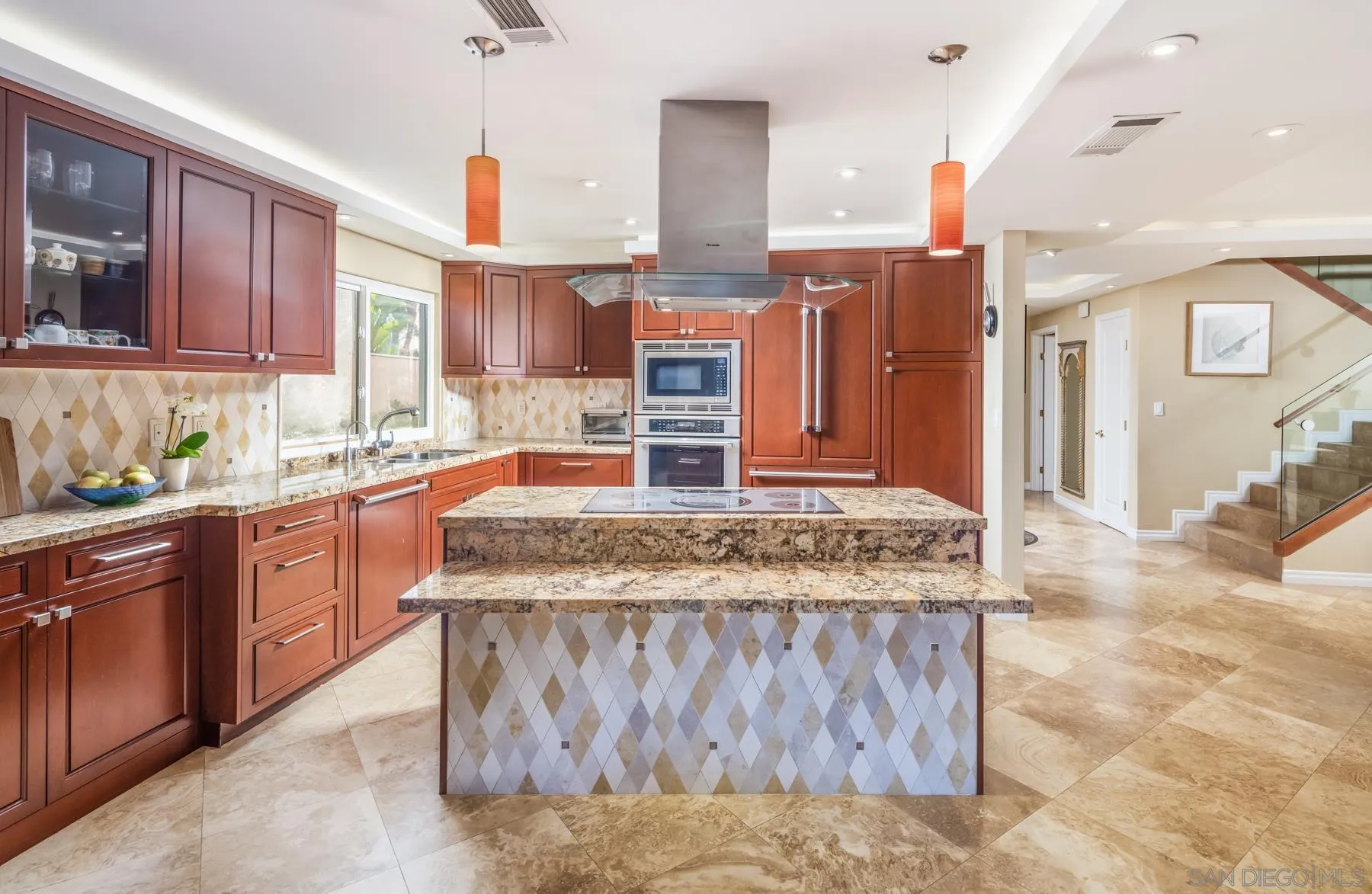 89 Trinidad Bend Coronado, CA 92118 - Photo 15 of 40 a kitchen with stainless steel appliances granite countertop a stove a sink and a refrigerator