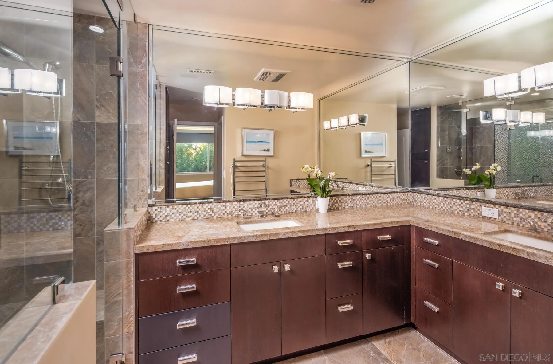 89 Trinidad Bend Coronado, CA 92118 - Photo 20 of 40 a bathroom with a granite countertop sink a large mirror and a shower
