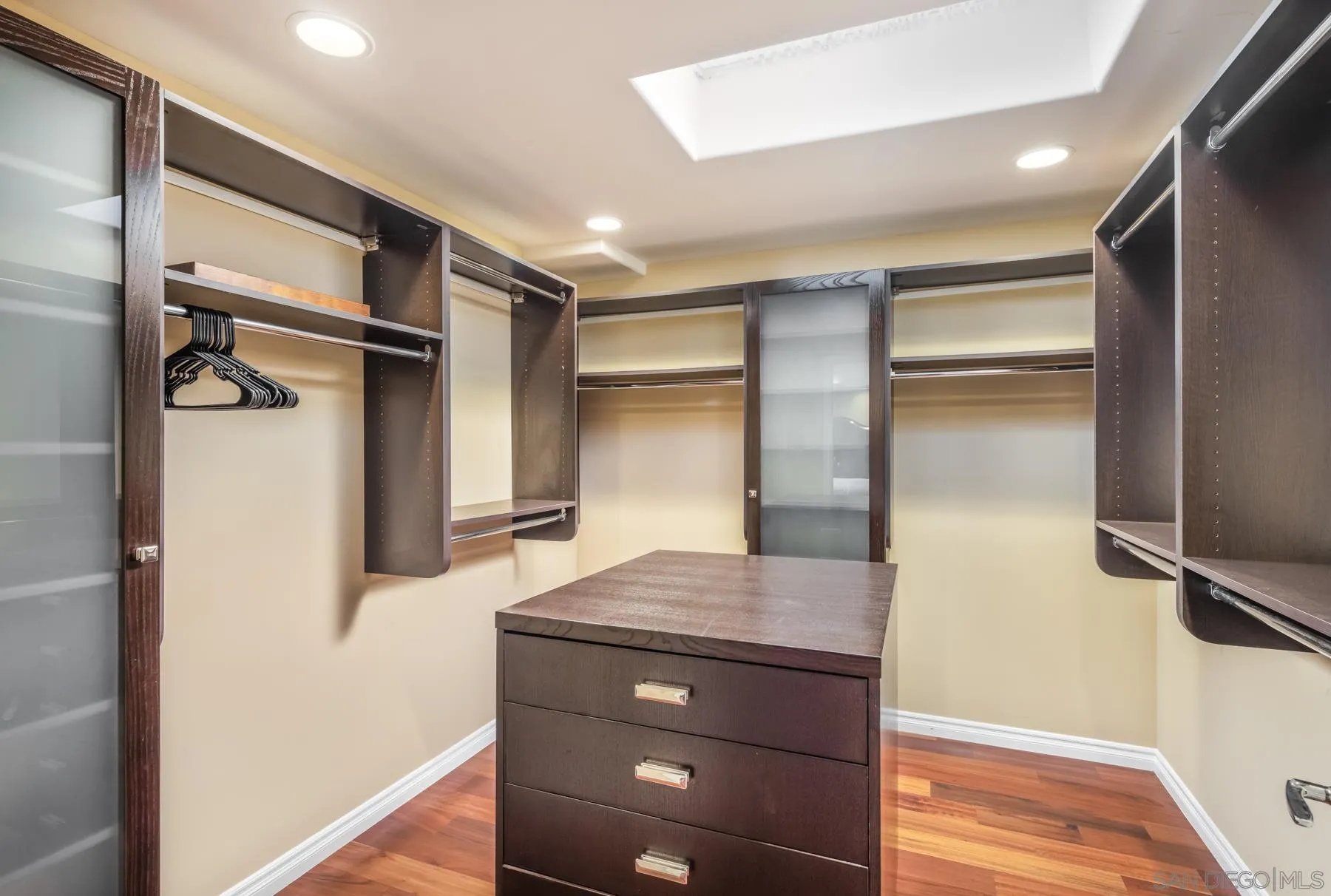 89 Trinidad Bend Coronado, CA 92118 - Photo 21 of 40 a view of walk in closet with clothes and shoes