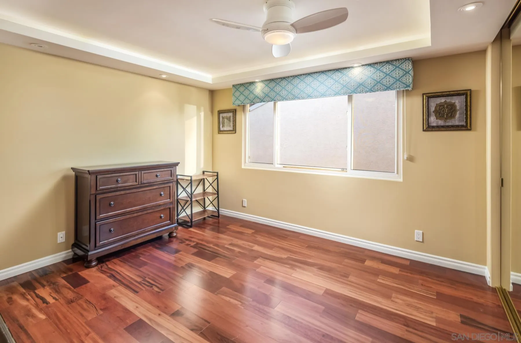 89 Trinidad Bend Coronado, CA 92118 - Photo 25 of 40 a view of an empty room with wooden floor and a window