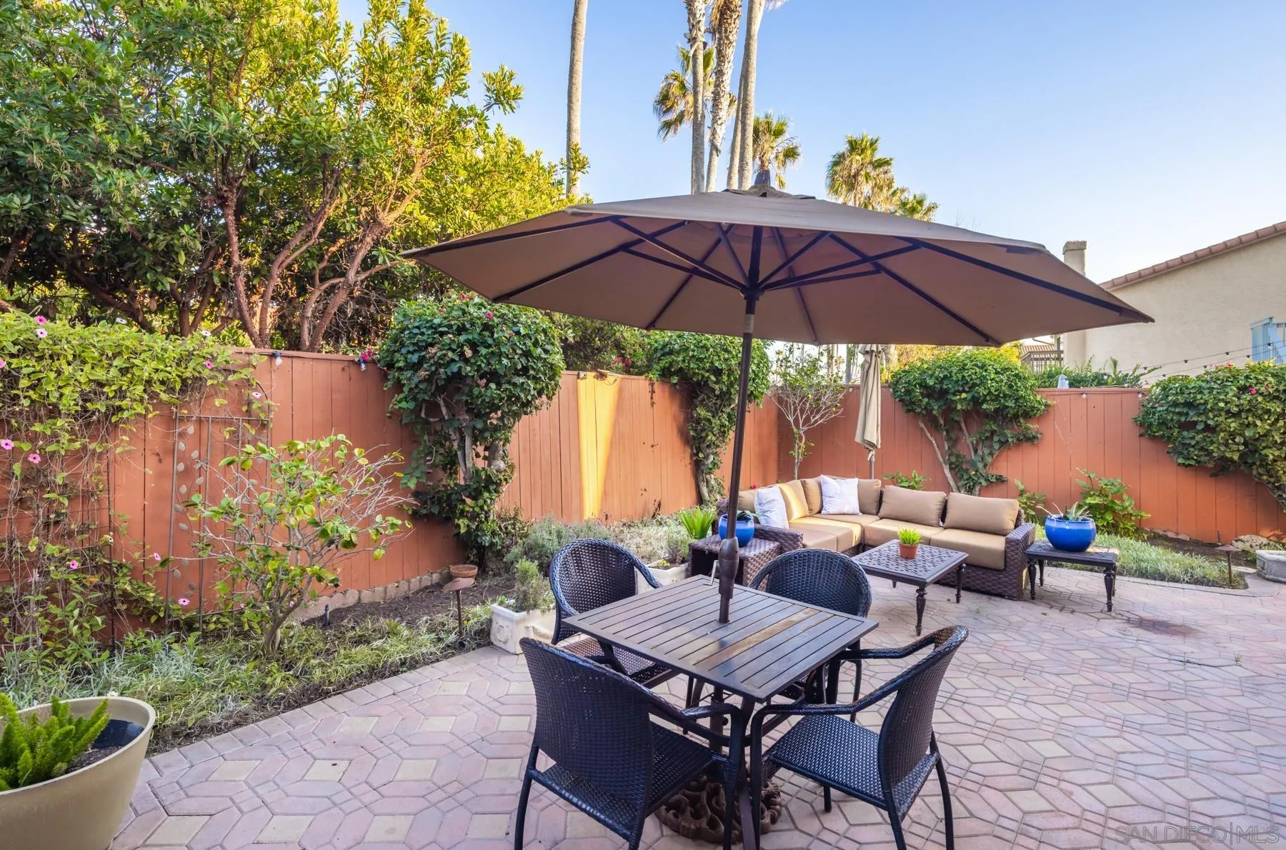89 Trinidad Bend Coronado, CA 92118 - Photo 30 of 40 an outdoor space with furniture and umbrella