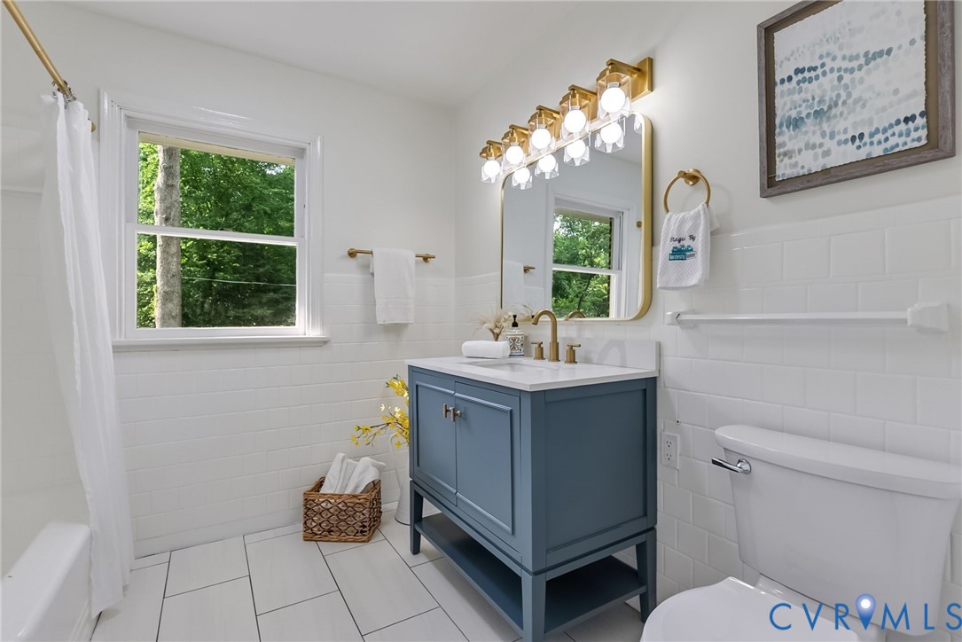 1136 Overbrook Road Petersburg, VA 23805 - Photo 25 of 51 Bathroom featuring a modern blue vanity with an in