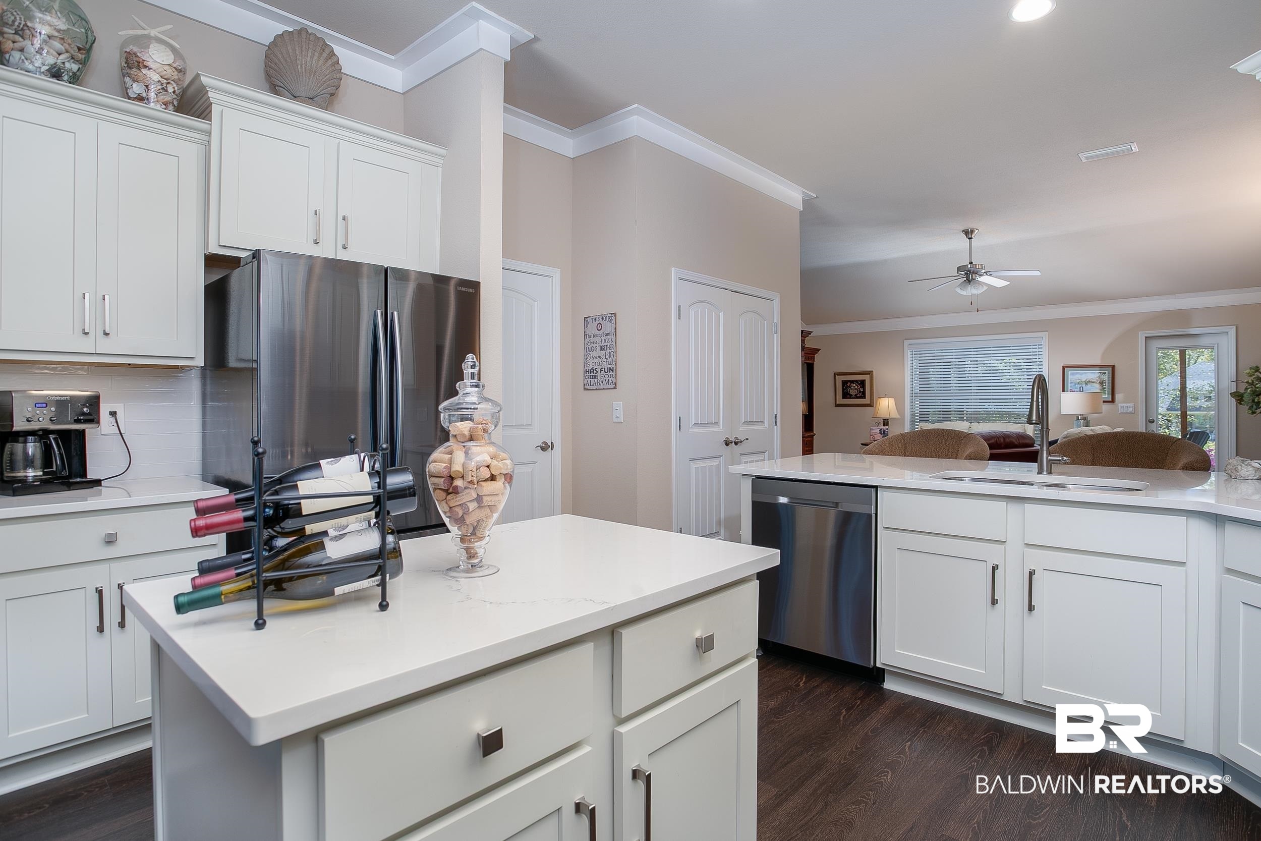 13154 Vincent Court Foley, AL 36535 - Photo 4 of 41 Kitchen featuring ornamental molding, stainless steel appliances, dark wood-type flooring, a sink, and ceiling fan
